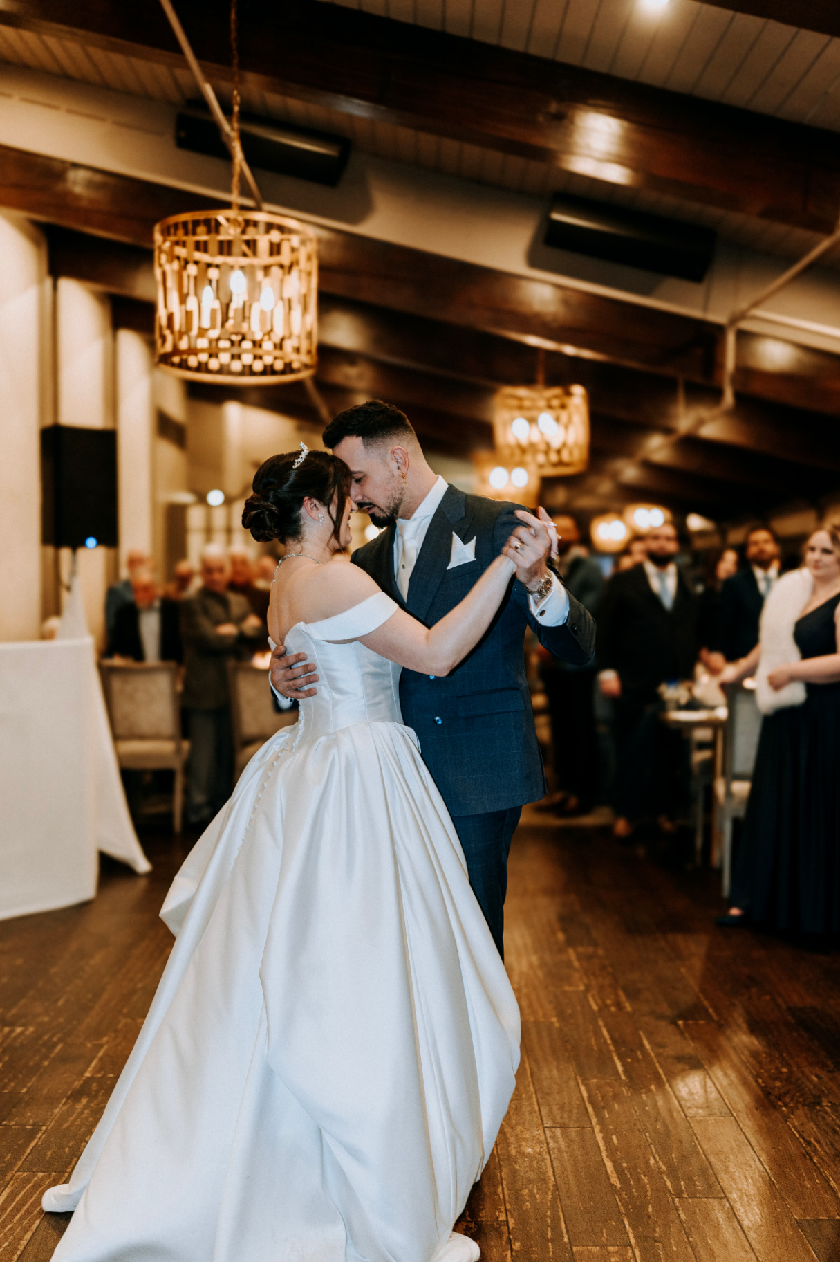 First dance under warm chandeliers