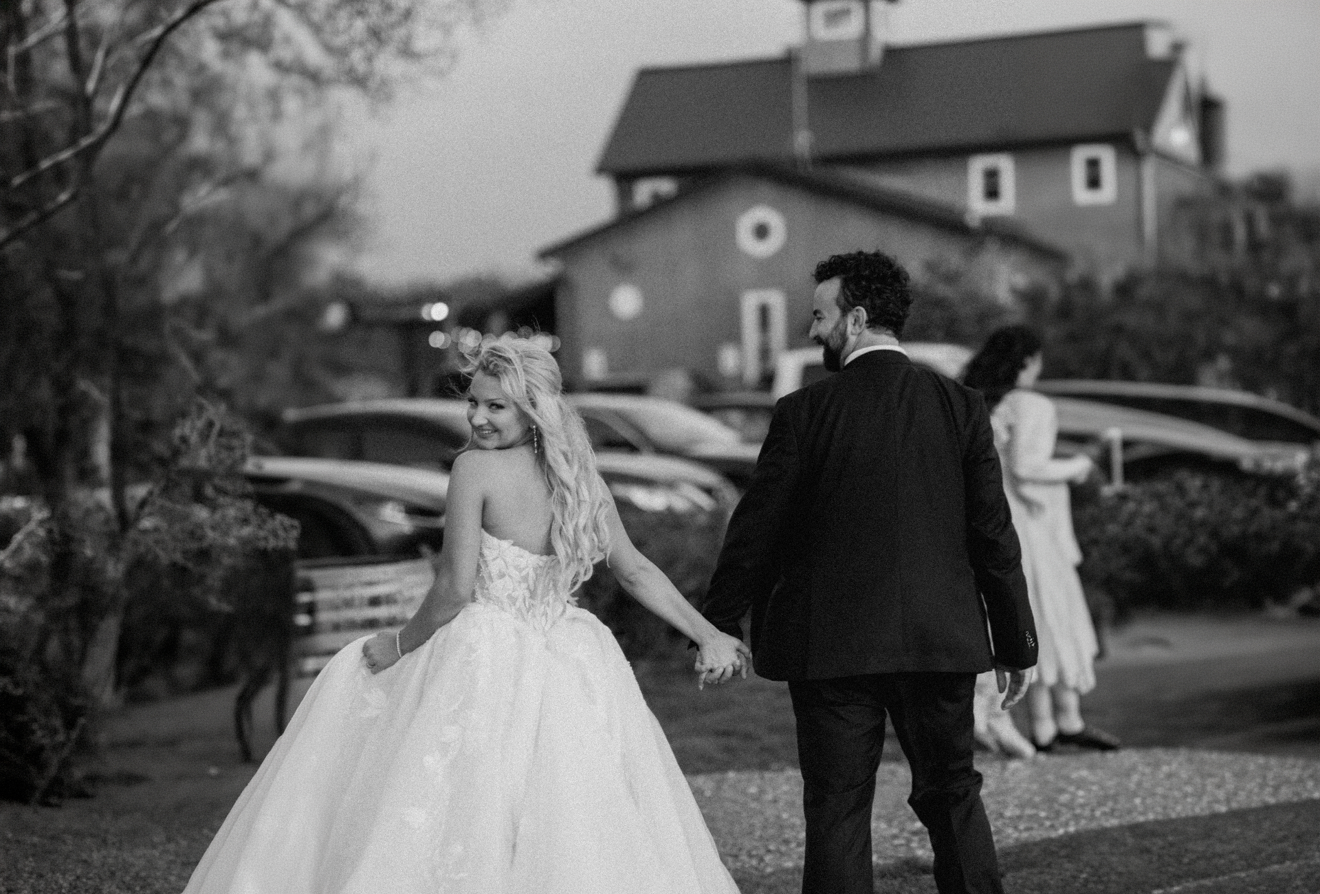 Bride and groom holding hands on their wedding day